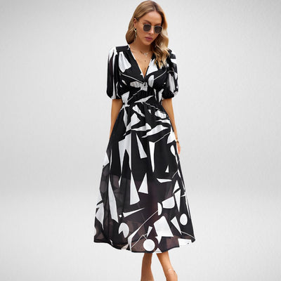 Maxikleid mit abstraktem Muster | Elegante Silhouette | Stilvolle Puffärmel